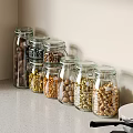 Neatly Arranged Glass Jars Filled With Assorted Nuts On Kitchen Countertop