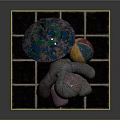 Patchwork Fabric Doll With Various Colors Sitting On Blue Tiled Platform