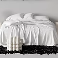 Elegant White Double Bed with Bedside Tables Round Lamps Black Rug and Decorative Spheres