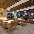 Modern Restaurant Interior With Wooden Decor Dining Tables Rattan Chairs And Hanging Lights