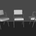 Three Modern Leisure Chairs with White Cushioned Seats and Black Metal Frames