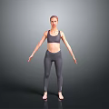 A Woman Wearing Grey Sports Bra And Leggings Standing With Arms Outstretched Against Grey Background