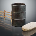 Rustic Wooden Barrel Next to Fence with Cloth Bag on Dark Surface