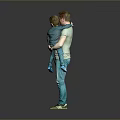 Man In Green Shirt Holding Child With Blue Pants Against Gray Background