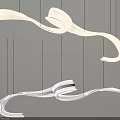 Modern Flowing Curved Chandelier with Metallic Ribbon Design and Hanging Strands in Interior
