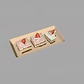 Three Layered Cakes Topped With Pink And White Cream And Silver Leaf On Rectangular Tray