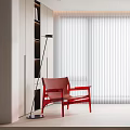 Red Lounge Chair with Floor Lamp beside White Blinds in Light Colored Room