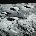 Rugged Lunar Surface Landscape Featuring Multiple Impact Craters and Rocky Terrain