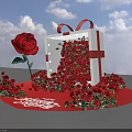Illuminated Floral Installation With White Gift Box Red Ribbon Bow And Abundant Red Roses