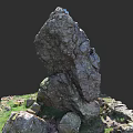 Natural Stone Rock Formation With Small Stones And Green Grass Base