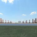 Modern High Rise Residential Buildings With Waterfront Green Grass And Blue Sky