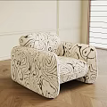 Modern Single Sofa With Abstract Black And White Pattern Rounded Armrests And Wooden Floor
