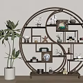 Traditional Chinese Circular Display Shelf With Decorative Items And Green Plant