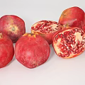 Assorted Fresh Fruits with Whole Sliced Pomegranates Plums Oranges and Scattered Kumquats
