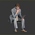 Man In Gray Suit Sitting Holding Tablet With Hand On Mouth Thinking
