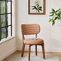 Stylish Dining Chair with Striped Backrest and Wooden Legs by Window with Green Plants