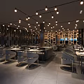 Modern Restaurant Interior With Hanging Pendant Lights Arranged Dining Tables And Stylish Wall Design