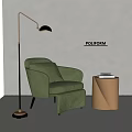 Green Velvet Accent Chair With Gold Side Table And Books Near Floor Lamp