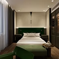 Modern Hotel Guest Room Interior with Green Headboard White Bed Linens and Wooden Flooring