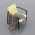 Yellow Cushioned Armchair with Black Armrests Legs and Plaid Blanket Draped