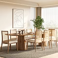Modern Restaurant Dining Area With Round Wooden Table Rattan Chairs Abstract Painting And Green Plant