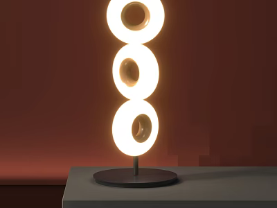 Unique Shaped Table Lamp with Three Circular Illuminated Rings on Gray Tabletop Against Red Background 3d model