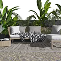 Outdoor Sofa with Cushions and Plaid Blanket on Wooden Deck by Lush Plants and Poolside