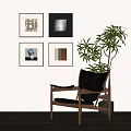 Minimalist Four Abstract Paintings On Wall With Wooden Chair And Green Plant In Interior Room