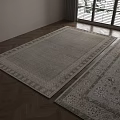 Two Patterned Square Rugs with Different Colors in Room with Wooden Floor and Large Windows