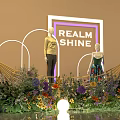 Elegant Window Display With REALM SHINE Sign Two Mannequins Colorful Flowers And Arched Lighting