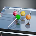 Colorful Lollipops With White Sticks Neatly Arranged On Transparent Crystal Tray