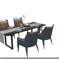 Modern Black Dining Table Set With Blue Chairs Gold Legs And Brown Cushions Vase