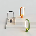 Modern Minimalist Table Lamps In Black Orange Green With Circular Design On White Platforms