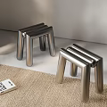 Modern Silver Metal Sofa Stools With Geometric Legs In Minimalist Living Space