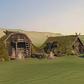 Traditional Thatched Houses on Green Grassland with Rolling Hills and Wooden Carts with Wheels
