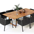 Wooden Dining Table Set With Black Chairs And Tabletop Greenery Decor Items