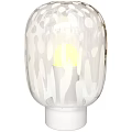 Modern Glass Table Lamp With White Patterns And Warm Yellow Illumination