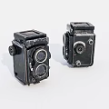 Two Vintage Twin Lens Reflex Cameras Black Classic Digital Camera Bodies On White Background
