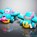 Two Turquoise Airplane Shaped Plush Dolls With Pink Nose And Yellow Base