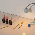 Desk Setup Featuring Desk Lamp Pen Holders Pencils Cone And Blue Sphere