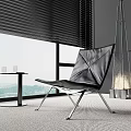 Black Leather Leisure Chair With Metal Frame Scenic Window View Side Table And Carpeted Floor