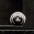 Modern Circular Illuminated Sculpture With Transparent Design And Striped Wall Background