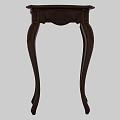 Classic Carved Wooden Accent Table With Ornate Leg Design And Intricate Details