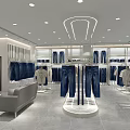 Modern Clothing Store Interior with Jeans Tops Display Racks and Mannequins