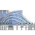 Modern Museum Building with Curved Glass Facade and Open Entrance Surrounded by Palm Trees
