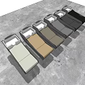 Modern Comfortable Massage Beds With Different Colored Surfaces Arranged On Gray Floor