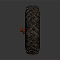 Old Off Road Tire With Deep Tread Pattern And Red Metal Rim