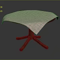 Patterned Light Colored Tablecloth On Round Wooden Leg Table For Home Use