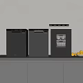 Modern Black Kitchen Appliances On White Countertop With Gray Cabinets And Yellow Lemons
