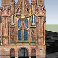 Historic Gothic Church With Red Brick Spires Crosses And Stained Glass Windows